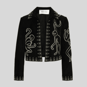 Product Description: Bring a dark, rock-infused luxury edge to your outerwear inventory with this studded suede biker jacket. Featuring a rich dark navy suede base heavily embellished with geometric silver metal studs and crystal-center floral motifs, this statement piece is designed to be a high-margin standout for modern boutiques, wholesale suppliers, and private label brands. Silver Stud & Crystal Embellishments: Featuring meticulously patterned metallic studs and dark crystal-centered floral motifs across the front, collar, sleeves, and hemline straight from our professional production line without adding unoriginal elements. Rich Suede Finish: Expertly crafted from premium suede with a deep navy tone to create a luxurious, tactile character. Biker Jacket Silhouette: Cut with a high stand collar, front zip closure, buckled sleeve cuffs, and welt pockets for contemporary streetwear appeal. Pure Authentic Core: Built on a structured jacket foundation, strictly maintaining the garment's original integrity for a premium finish. Product Specifications & Customization: Material: 100% Premium Suede Leather (Customizable fabric blends available upon request) Category: Jackets & Outerwear / Streetwear Collection MOQ (Minimum Order Quantity): 300 pcs per style (Supports mixed sizing) OEM/ODM Services: Custom branding, woven/metal labels, tags, and bespoke finishes available for global wholesale buyers.